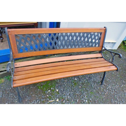 5499 - WOODEN GARDEN BENCH WITH WROUGHT METAL ENDS AND PANEL BACK