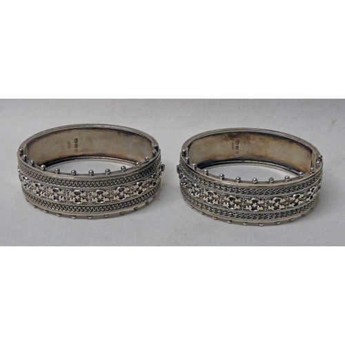 557 - PAIR OF VICTORIAN SILVER HINGED BANGLES WITH DECORATIVE FRONTS BY ROBERT JAMES DICK, BIRMINGHAM 1885... 