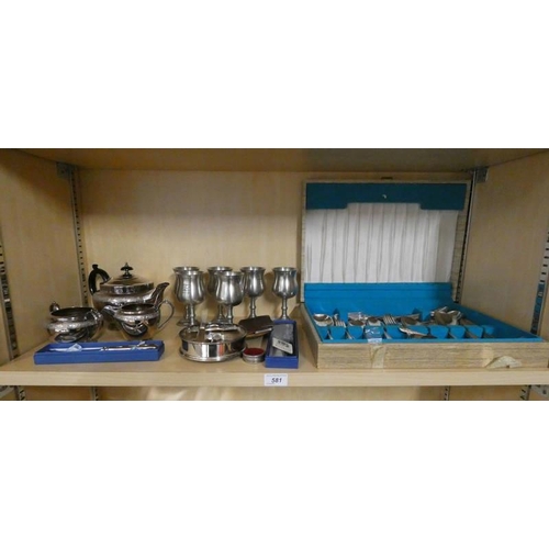 581 - SILVER PLATED 3 PIECE TEASET, CASED CUTLERY, SILVER PLATED KNIVES ETC ON ONE SHELF