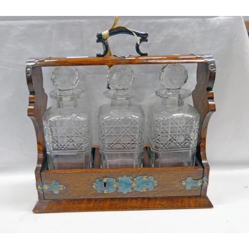 585 - EARLY 20TH CENTURY OAK & SILVER PLATE  3 - DECANTER TANTALUS