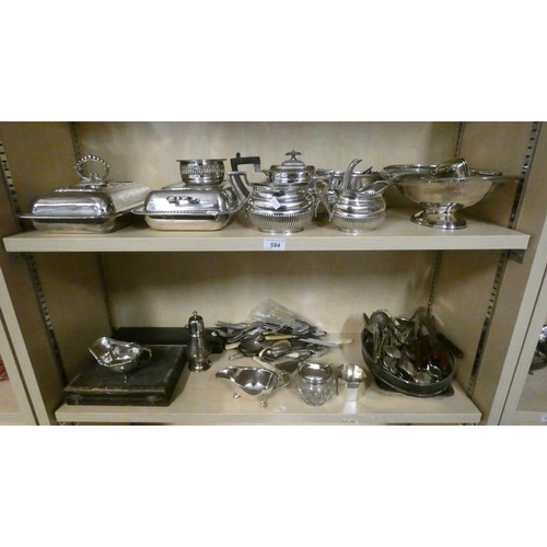 594 - SELECTION OF SILVER PLATED WARE INCLUDING 3 PIECE TEASET, ENTREE DISHES, CUTLERY ETC ON 2 SHELVES