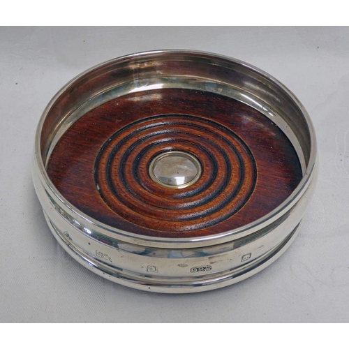 85 - MODERN SILVER WINE COASTER WITH TURNED WOODEN BASE