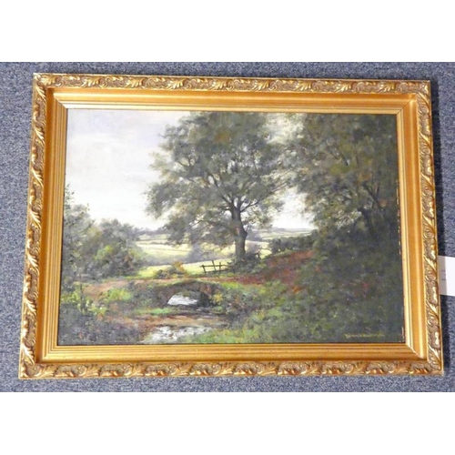 1100I - NORMAN MACDOUGALL,  A SMALL BRIDGE IN A FOREST SIGNED GILT FRAMED OIL PAINTING 38 X 55 CM