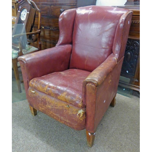 122 - OVERSTUFFED RED LEATHER WINGBACK ARMCHAIR ON SQUARE SUPPORTS