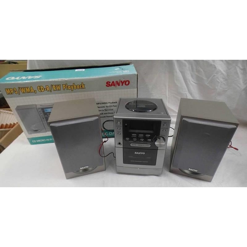 2128 - SANYO MP3, CD, FM MICRO HI-F- SYSTEM TOGETHER WITH VARIOUS CDS