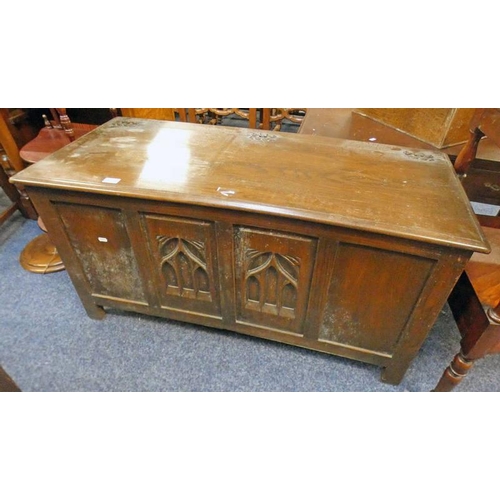 276 - 19TH CENTURY STYLE CARVED OAK COFFER ON SQUARE SUPPORTS, 56CM TALL X 110CM WIDE