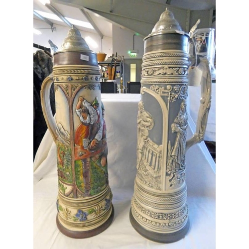 3082 - PAIR OF GERMAN MADE STEINS, HAND PAINTED BY A PROZL, TALLEST 59.5 CM
