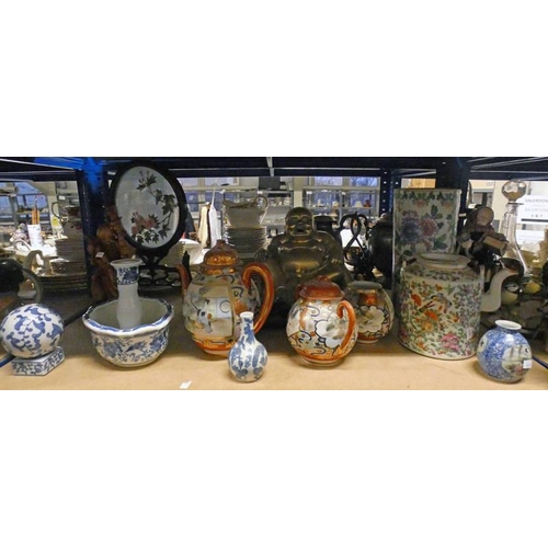 3166 - VARIOUS ORIENTAL WARE ON ONE SHELF WITH BRASS BHUDDA ON STAND, BLUE & WHITE WARE ETC ON ONE SHELF