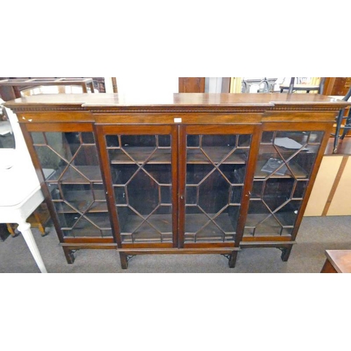 510 - EARLY 20TH CENTURY MAHOGANY BREAKFRONT BOOKCASE WITH 4 ASTRAGAL GLASS PANEL DOORS ON SQUARE SUPPORTS... 