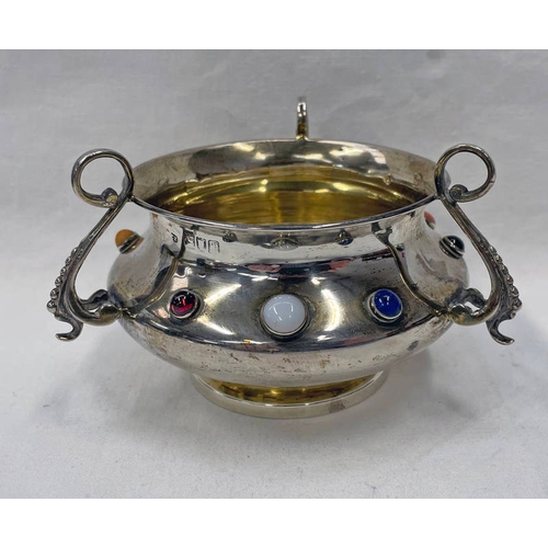 66 - ARTS & CRAFTS SILVER 3 - HANDLED CIRCULAR BOWL WITH GILT INTERIOR & 3 SCROLL ARMS, STUDDED WITH CABO... 