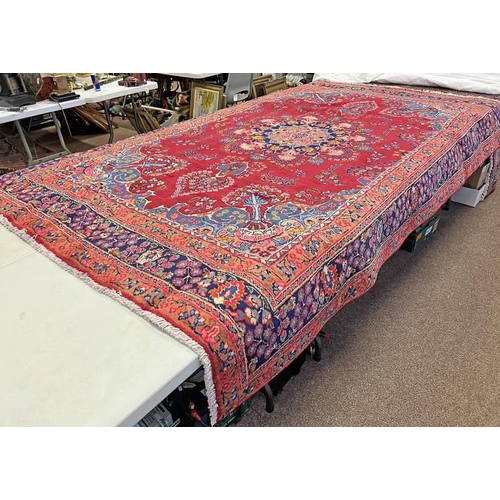 1415 - RED GROUND PERSIAN TABRIZ CARPET WITH CENTRAL MEDALLION DESIGN WITH A UNIQUE BORDER 290 X 195CM