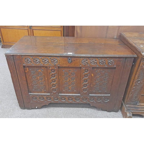 50 - OAK COFFER WITH DECORATIVE CARVING TO FRONT, 17TH CENTURY BY REPUTE. 72CM TALL X 118CM WIDE