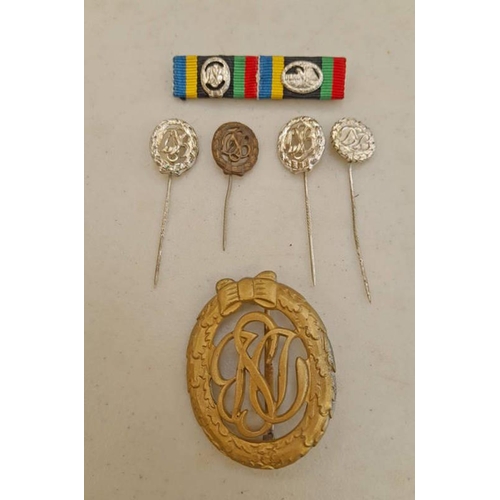 1101 - POST 1957 GERMAN BRONZE SPORTS BADGE & 4 STICKPINS & MEDAL BAR