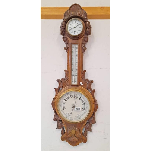 1272 - EARLY 20TH CENTURY CARVED OAK ANEROID BAROMETER WITH CIRCULAR CLOCK WITH WHITE ENAMEL FACE TO TOP