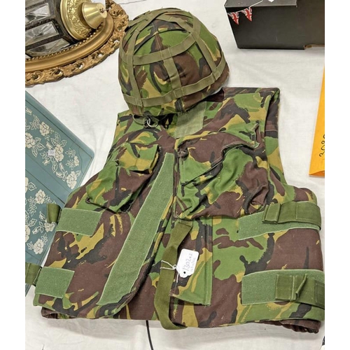 1374 - BRITISH MK 6 VARIANT HELMET WITH INTERIOR LINER, CAMO COVER AND STRAPS ALONG WITH A COMBAT BODY ARMO... 