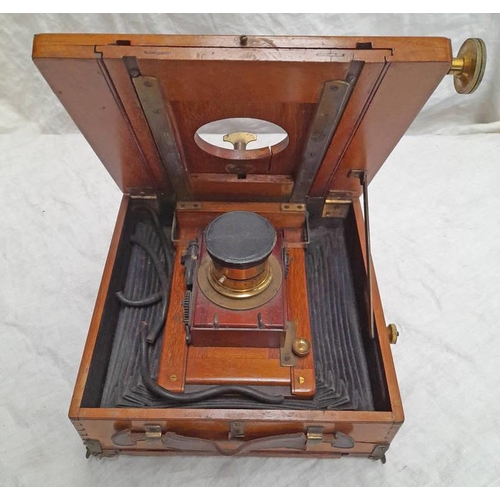 2197 - OAK CASED FOLDING CAMERA WITH GLASS PANEL TO REAR, BRASS FITTINGS AND LEATHER HANDLE AND LENS COVER.