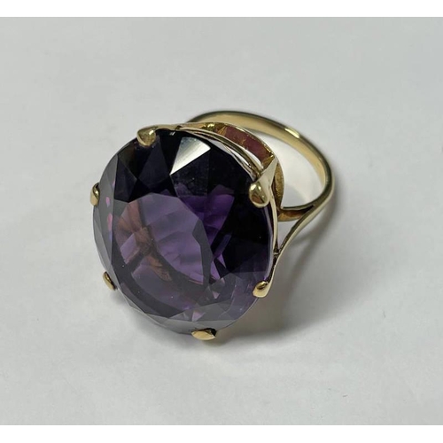 46 - AMETHYST SET RING, THE OVAL FACETED AMETHYST APPROX. 40 CARATS