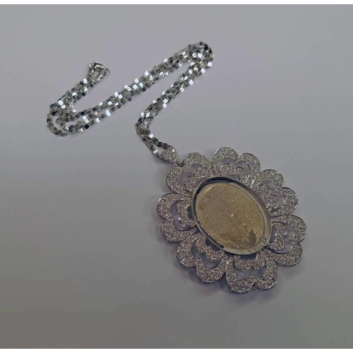 79 - WHITE GOLD OVAL PENDANT ON AN 18CT GOLD CHAIN, PENDANT UNMARKED BUT TESTS AS 18CT - 24.2 G