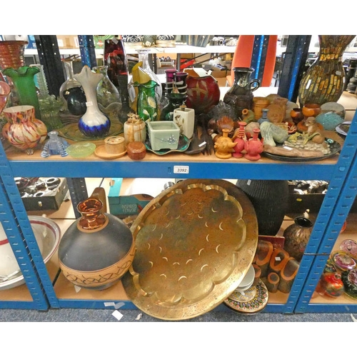 3392 - 2 SHELVES OF ART GLASS, EASTERN BRASS TRAY, ORNAMENTS, ETC