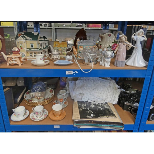 3405 - 2 SHELVES OF DECORATIVE TEAPOTS, NAO FIGURES, ROYAL ALBERT PLATES, ETC