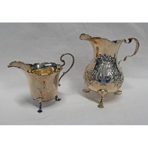 99 - SILVER CREAM JUG WITH FOLIATE EMBOSSED DECORATION, BIRMINGHAM 1892 & A SMALL SILVER CREAM JUG - 135G... 