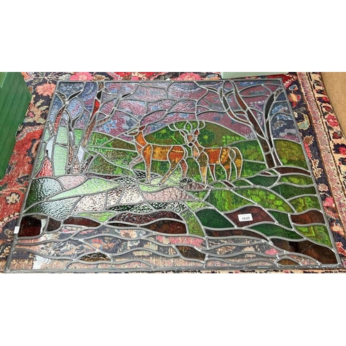 1645 - COLOURED LEADED GLASS PANEL OF DOE AND STAG IN WOOD LAND .  74 X 86.5CM