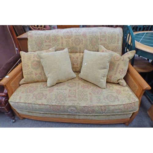 5110 - ERCOL OAK FRAMED 2 SEATER SETTEE WITH BERGERE PANEL SIDES