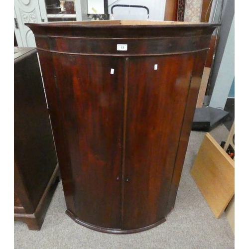 5295 - 19TH CENTURY MAHOGANY BOW FRONT CORNER CABINET WITH SHELVED INTERIOR BEHIND 2 PANEL DOORS. 125 CM TA... 