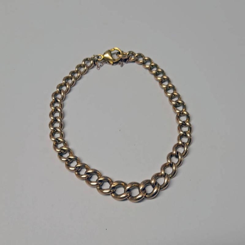 85 - 9CT GOLD CURB LINK BRACELET - 21.7 G