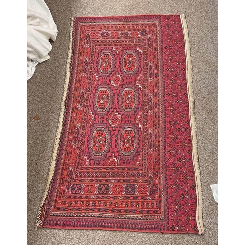 1423 - RED GROUND MIDDLE EASTERN RUG/SADDLE RUG 144 X 81 CM