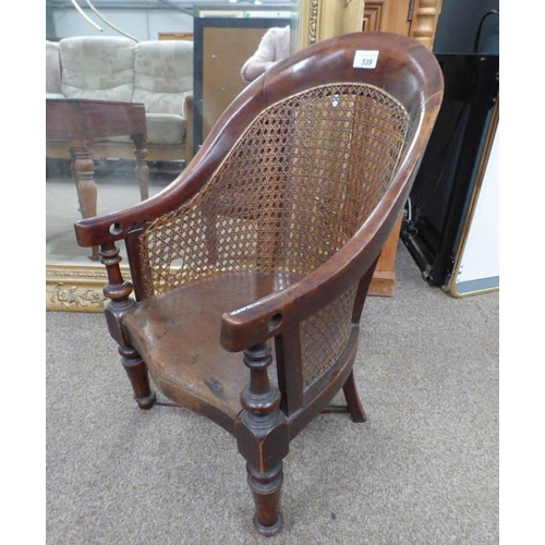 539 - 19TH CENTURY MAHOGANY FRAMED BERGERE CHILD'S CHAIR ON TURNED SUPPORTS WITH UNDERSTRETCHERS