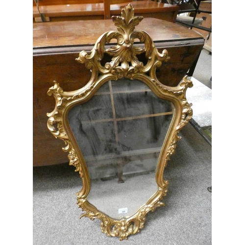 68 - DECORATIVE GILT WALL MIRROR WITH SHAPED GLASS, OVERALL HEIGHT 82CM