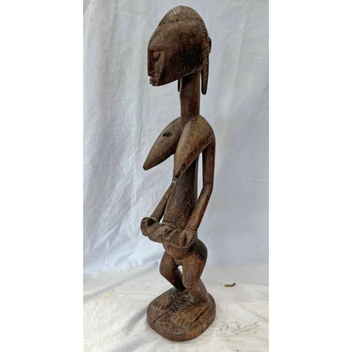 1256 - IGE AFRICAN STANDING FEMALE FIGURE HOLDING A BABY, CARVED WOODEN FORM, LARGE PRONOUNCED BREASTS, ON ... 