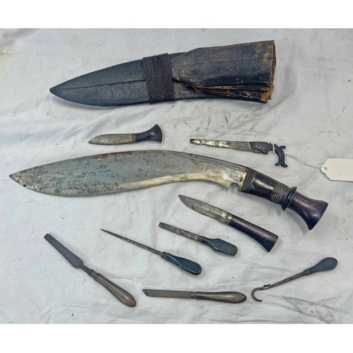 1456 - KUKRI WITH A SELECTION OF UTENSILS TO INCLUDE SAW, FILE, HOOK, ETC ALL CONTAINED IN ITS LEATHER SCAB... 