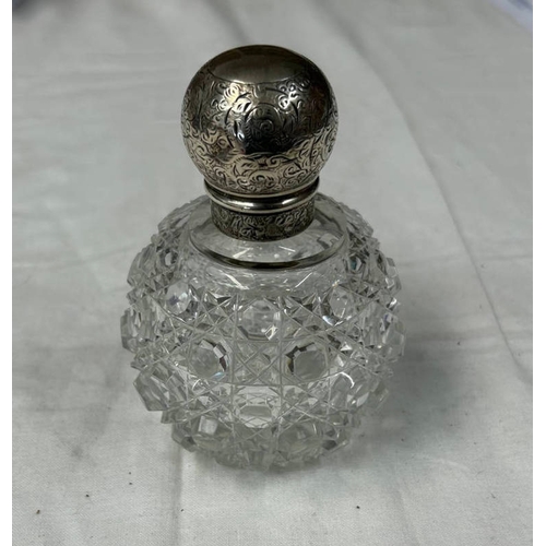 153 - SILVER MOUNTED CUT GLASS SCENT BOTTLE WITH SCREW OFF TOP, LONDON 1890