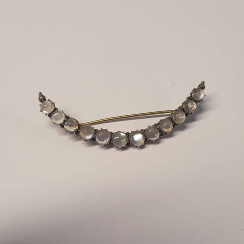 202 - EARLY 20TH CENTURY MOONSTONE CRESCENT SHAPED BROOCH - 7CM LONG