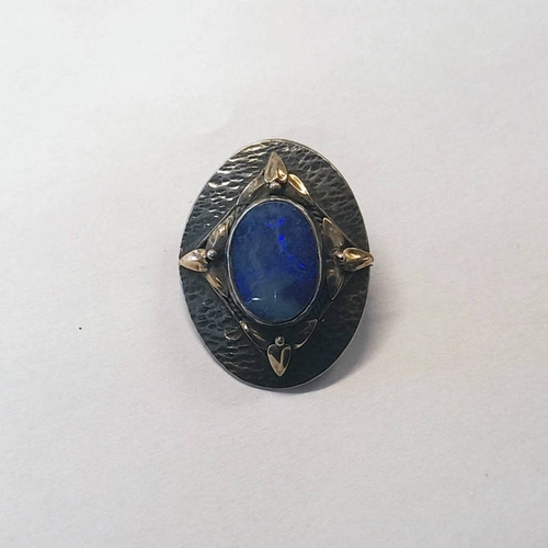 210 - EARLY 20TH CENTURY OVAL SILVER HAMMER EFFECT OPAL BROOCH MARKED DAWN REG'D TO REVERSE - 3.5CM LONG