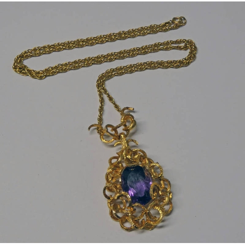 229 - AMETHYST SET PENDANT ON A 9CT GOLD ROPETWIST CHAIN, THE OVAL FACETED AMETHYST SET WITHIN A DECORATIV... 