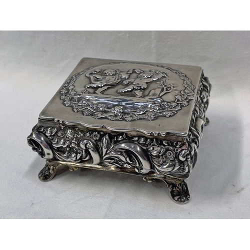 268 - EDWARDIAN SILVER JEWELLERY BOX WITH PADDED INTERIOR, THE LID EMBOSSED WITH CHERUBS ON 4 SCROLL FEET,... 