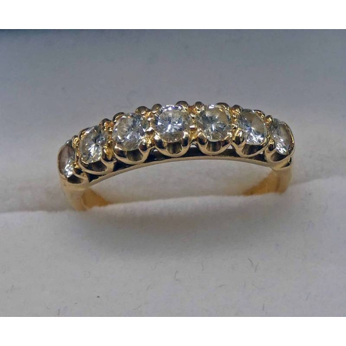 423 - GOLD 7 - STONE DIAMOND SET RING, THE CENTRE STONE APPROX 0.14 CARATS