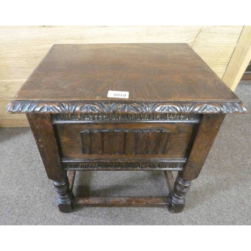 5019 - EARLY 20TH CENTURY OAK STOOL WITH CARVED AND LINEN FOLD DECORATION  WITH LIFT UP LID ON TURNED SUPPO... 