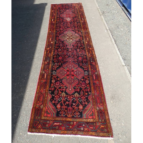 5049 - THE PERSIAN COMPANY IRANIAN RUNNER WITH RED & BLACK PATTERN, 305CM LONG X 86CM WIDE