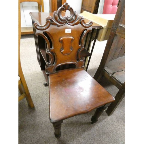 5057 - 19TH CENTURY MAHOGANY HALL CHAIR WITH DECORATIVE CARVED BACK ON TURNED SUPPORTS