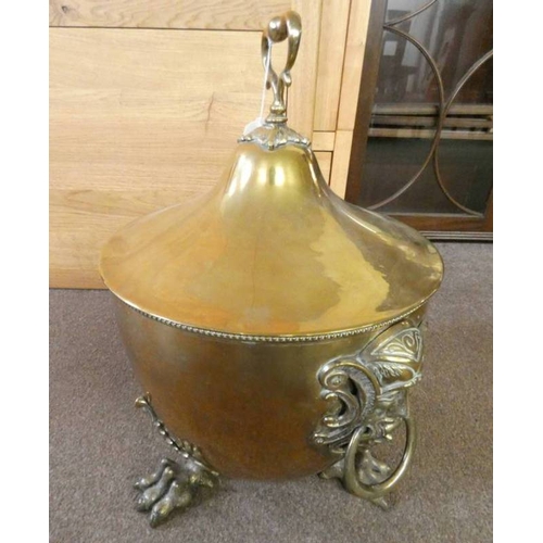 5081 - 19TH CENTURY BRASS LIDDED COAL BIN WITH DECORATIVE MASK HANDLES ON PAW FEET, DIAMETER 36CM