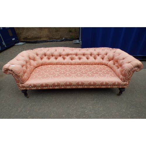 5161 - LATE 19TH/EARLY 20TH CENTURY OVERSTUFFED BUTTON BACK SETTEE ON TURNED MAHOGANY SUPPORTS