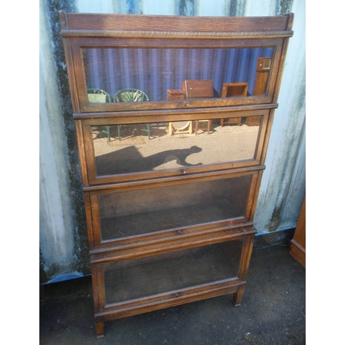 5427 - 20TH CENTURY OAK SECTIONAL BOOKCASE WITH 4 GLAZED PANEL DOORS LABELLED GLOBE-WERNICKE TO INTERIOR