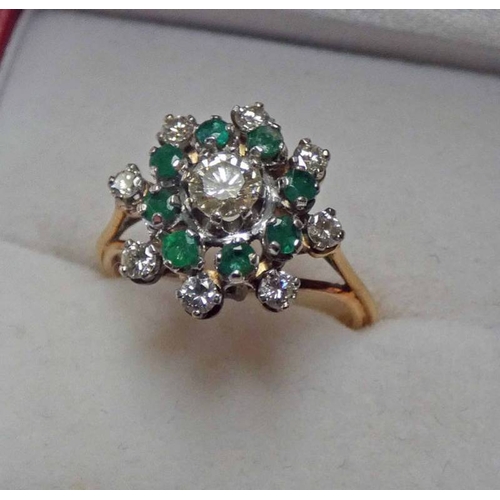 67 - EMERALD AND DIAMOND SET CLUSTER RING MARKED 18CT THE CENTRALLY SET DIAMOND OF APPROX. 0.25 CARAT