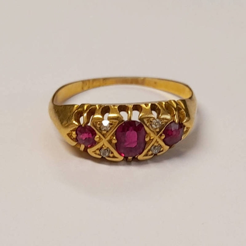 94 - 18CT GOLD RUBY & DIAMOND SET RING, THE 3 OVAL FACETED RUBIES INTERSPERSED WITH RUBIES IN A SCROLL SE... 