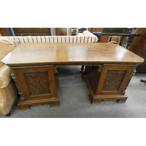 23 - LATE 19TH CENTURY OAK TWIN PEDESTAL DESK WITH CARVED PANEL DOORS OPENING TO DRAWERS, 170CM