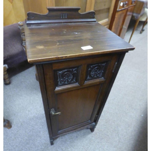 28 - EARLY 20TH CENTURY WALNUT BEDSIDE CABINET WITH CARVED PANELS